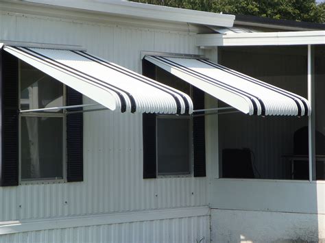 fabric vs aluminum awnings|durability of metal awnings.